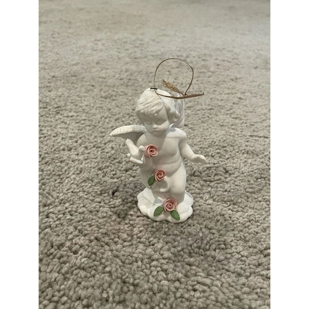 WHITE PORCELAIN ANGEL W/ 3 PORCELAIN ROSES HOLDING A‎ DOVE ORNAMENT